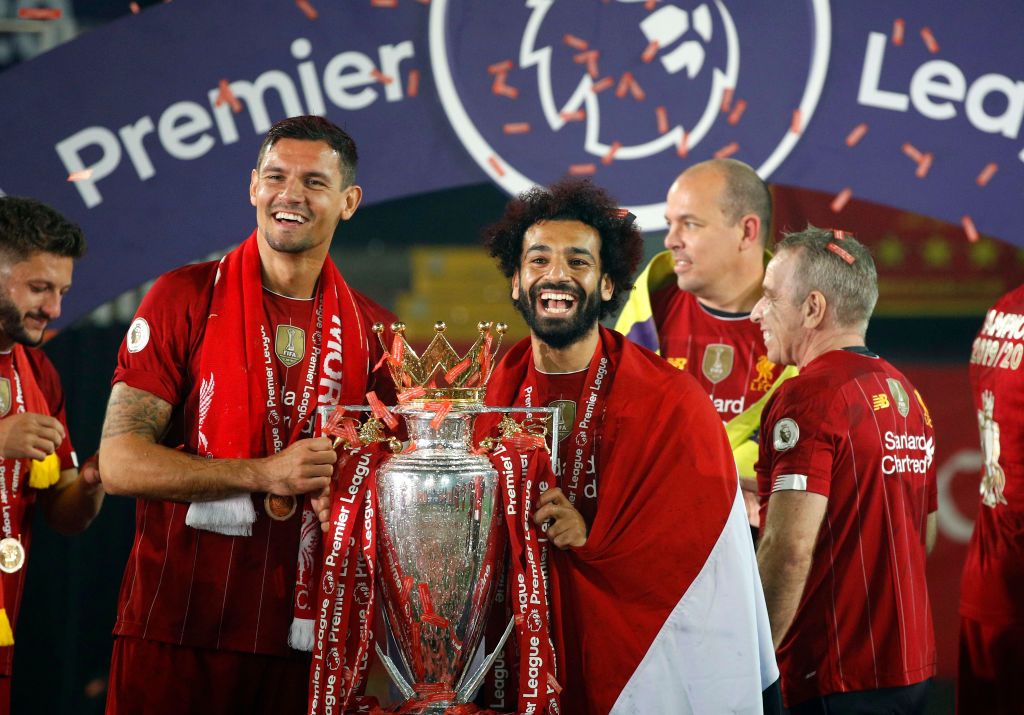 Dejan Lovren LIVERPOOL, ENGLAND - JULY 22: Dejan Lovren and Mohamed Salah of Liverpool celebrate with The Premier League trophy following the Premier League match between Liverpool FC and Chelsea FC at Anfield on July 22, 2020 in Liverpool, England. Football Stadiums around Europe remain empty due to the Coronavirus Pandemic as Government social distancing laws prohibit fans inside venues resulting in all fixtures being played behind closed doors. (Photo by Phil Noble/Pool via Getty Images)