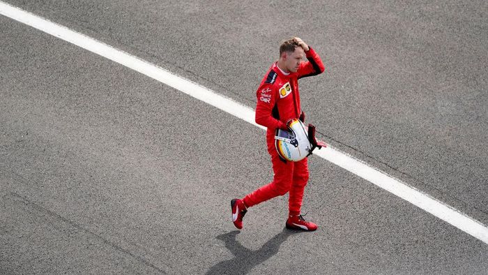 Sebastian Vettel NORTHAMPTON, ENGLAND - AUGUST 02: Sebastian Vettel of Germany and Ferrari reacts in parc ferme during the F1 Grand Prix of Great Britain at Silverstone on August 02, 2020 in Northampton, England. (Photo by Will Oliver/Pool via Getty Images)