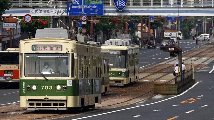 Hiroshima Tram A commuter tram approaches to a stop in Hiroshima, western Japan, Monday, Aug. 3, 2020. A tram which survived the Hiroshima atomic bombing will run, without any passenger, on the streets on Aug. 6 to commemorate the day of atomic bombing in the city. (AP Photo/Eugene Hoshiko)