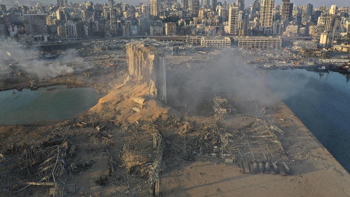 A drone picture shows smoke from the scene of an explosion at the seaport of Beirut, Lebanon, Wednesday, Aug. 5, 2020. A massive explosion rocked Beirut on Tuesday, flattening much of the citys port, damaging buildings across the capital and sending a giant mushroom cloud into the sky. (AP Photo/Hussein Malla)