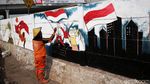 Pasukan Oranye Percantik Ibu Kota dengan Mural Kemerdekaan