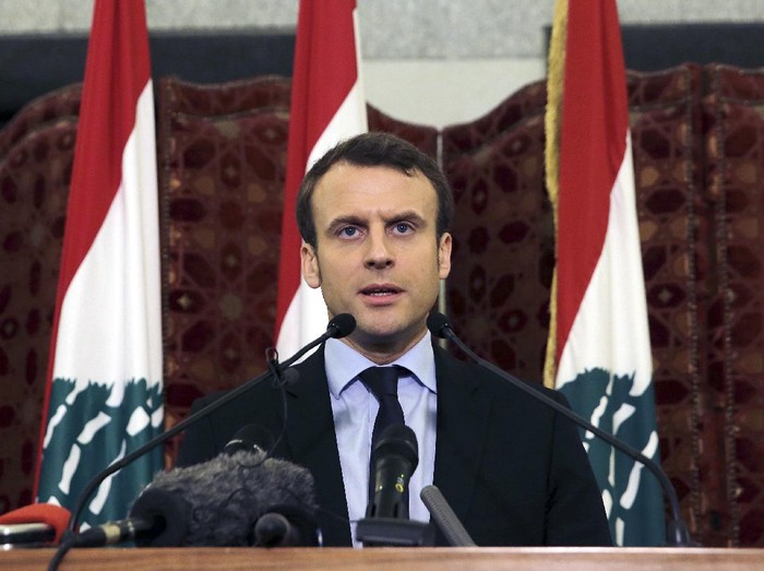 FILE - In this Tuesday, Jan. 24, 2017 file photo, French presidential candidate and former French Economy Minister Emmanuel Macron speaks during a press conference at the Government House, in downtown Beirut, Lebanon. French President Emmanuel Macron is traveling to Lebanon on Thursday Aug. 6, 2020, to offer support for the country after the massive, deadly explosion in Beirut. Lebanon is a former French protectorate and the countries retain close political and economic ties.  (AP Photo/Bilal Hussein, File)
