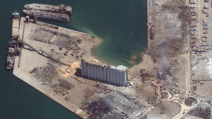 This satellite image taken on Wednesday Aug. 5, 2020 shows the port of Beirut and the surrounding area in Lebanon following a massive blast on Tuesday. Residents of Beirut confronted a scene of utter devastation a day after a massive explosion at the port rippled across the Lebanese capital, killing at least 100 people, wounding thousands and leaving entire city blocks blanketed with glass and rubble. (Planet Labs Inc. via AP)