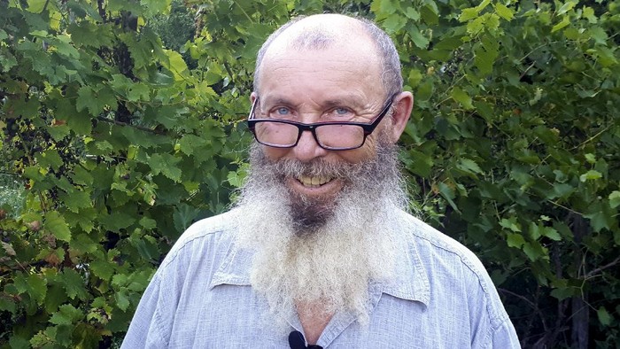 Boris Prokoshev, a sea captain poses for a photo after his interview with the Associated Press outside Sochi, Russia, Thursday, Aug. 6, 2020. When Boris Prokoshev, a sea captain spending his retirement years in a southern Russia village, woke up and found an email saying a ship he once commanded had carried the ammonium nitrate that devastatingly exploded in Beirut, he was astonished. The 2,750 tons of ammonium nitrate that blew up in Beirut’s port on Tuesday wasn’t supposed to be in Lebanon at all. It was bound from the Black Sea for Mozambique, but made an unscheduled detour to Beirut and never left there. (AP Photo/Kirill Lemekh)