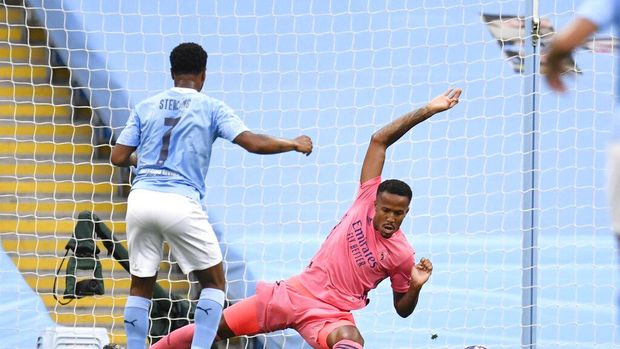 Manchester City's Raheem Sterling scores his side's first goal during the Champions League, round of 16, second leg soccer match between Manchester City and Real Madrid at the Etihad Stadium stadium in Manchester, England, Friday, Aug. 7, 2020. (Peter Powell/Pool Photo via AP)
