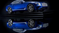 Miniatur Bentley Continental GT ini sangat detail. Pintu dan bagasinya bisa dibuka-tutup. Die-cast tersebut dikembangkan di bawah pengawasan ketat dari Bentley Design Studio. Foto: Pool (Carscoops)
