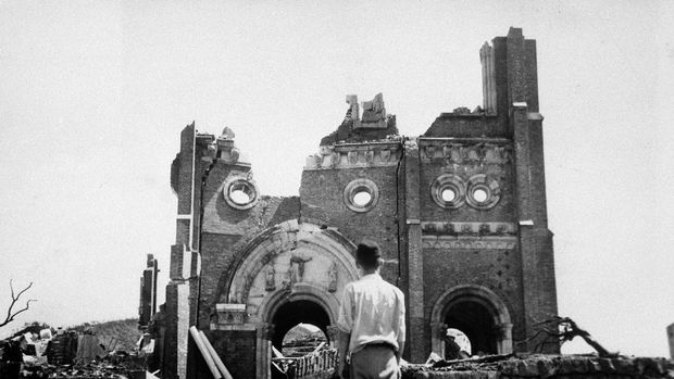 FILE - In this Sept. 13, 1945, file photo, the Urakami Catholic Cathedral in Nagasaki, Japan, stands waste in the aftermath of the detonation of the atom bomb over a month ago over this city. The city of Nagasaki in southern Japan marks the 75th anniversary of the U.S. atomic bombing of Aug. 9, 1945. It was a second nuclear bomb dropped by the U.S. three days after it made the world’s first atomic attack on Hiroshima. Japan surrendered on Aug. 15, ending World War II and its nearly a half-century aggression toward Asian neighbors. Dwindling survivors, whose average age exceeds 83, increasingly worry about passing their lessons on to younger generations.(AP Photo/Stanley Troutman, Pool, File)