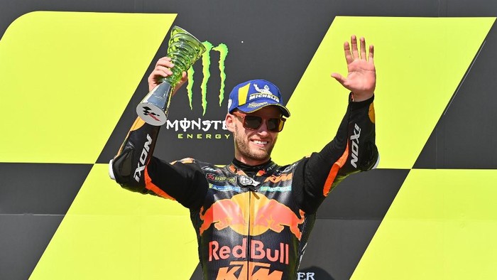 Winner Red Bull KTM Factory Racings South African Brad Binder celebrates during the winners ceremony after the Moto GP Czech Grand Prix at Masaryk circuit in Brno on August 9, 2020. (Photo by Joe Klamar / AFP)