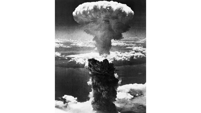 FILE  - In this Aug. 9, 1945, file photo, a giant column of smoke rises after the second atomic bomb ever used in warfare explodes over the Japanese port town of Nagasaki. The city of Nagasaki in southern Japan marks the 75th anniversary of the U.S. atomic bombing of Aug. 9, 1945. Japan surrendered on Aug. 15, ending World War II and its nearly a half-century aggression toward Asian neighbors. Dwindling survivors, whose average age exceeds 83, increasingly worry about passing their lessons on to younger generations. (AP Photo, File)
