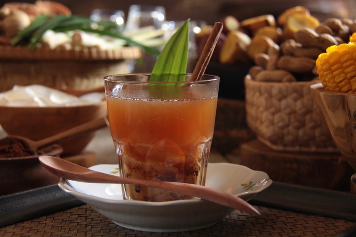 Root of ginger on wooden table