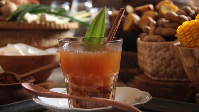 Root of ginger on wooden table