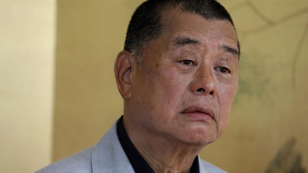 FILE - In this July 1, 2020, file photo, Hong Kong media tycoon Jimmy Lai pauses during an interview in Hong Kong. An aide to Hong Kong media tycoon Jimmy Lai says Lai was arrested Monday morning, Aug. 10, 2020, under the city’s national security law on suspicion of collusion with foreign powers. (AP Photo/Vincent Yu, File)