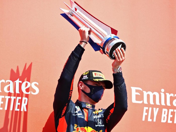 NORTHAMPTON, ENGLAND - AUGUST 09: Race winner Max Verstappen of Netherlands and Red Bull Racing celebrates on the podium during the F1 70th Anniversary Grand Prix at Silverstone on August 09, 2020 in Northampton, England. (Photo by Mark Thompson/Getty Images)