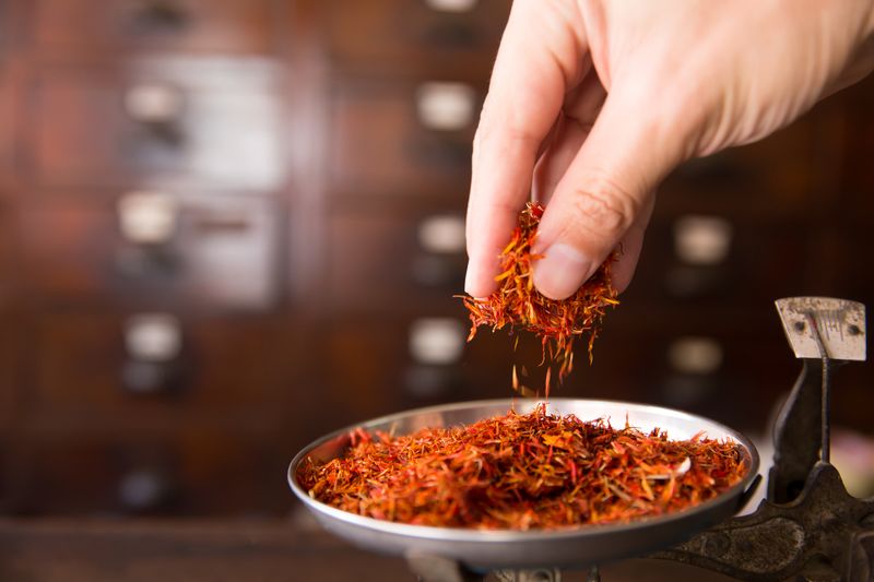 Safflower for diet tea and healthy low fat cooking oil herbal in herb store background