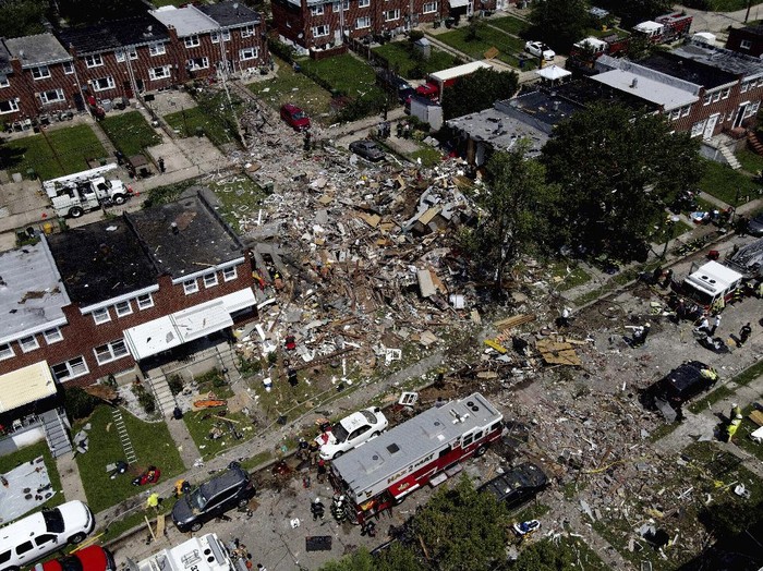 Debris and rubble covers the ground in the aftermath of an explosion in Baltimore on Monday, Aug. 10, 2020. Baltimore firefighters say an explosion has leveled several homes in the city. (AP Photo/Julio Cortez)