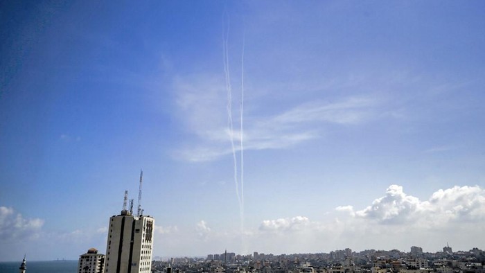 This picture taken on August 10, 2020 from Gaza City shows a view of smoke trails from test rockets fired by the Palestinian Islamist Hamas movement which currently controls the Gaza Strip, as part of military drills. - The rockets were a 