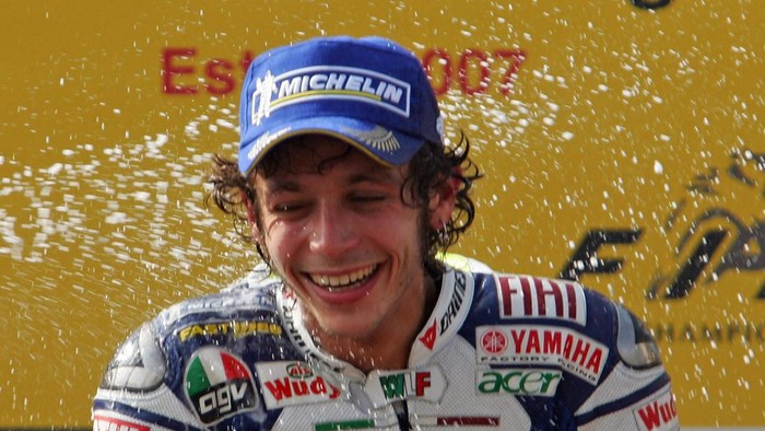 ESTORIL, PORTUGAL - SEPTEMBER 16:  Valentino Rossi of Italy celebrates on the podium after winning the MotoGP class race in the MotoGP of Portugal at the Estoril racetrack on September 16, 2007 in Estoril, Portugal.  (Photo by Denis Doyle/Getty Images)