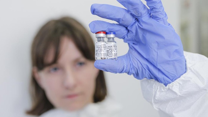In this handout photo taken on Thursday, Aug. 6, 2020, and provided by Russian Direct Investment Fund, a new vaccine is on display at the Nikolai Gamaleya National Center of Epidemiology and Microbiology in Moscow, Russia. Russia on Tuesday, Aug. 11 became the first country to approve a coronavirus vaccine for use in tens of thousands of its citizens despite international skepticism about injections that have not completed clinical trials and were studied in only dozens of people for less than two months. (Alexander Zemlianichenko Jr/ Russian Direct Investment Fund via AP)