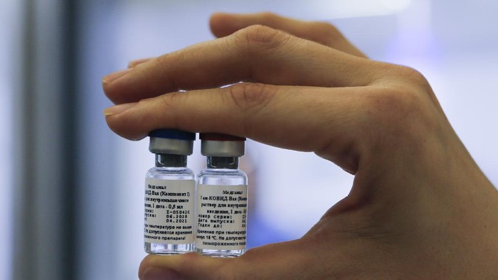In this handout photo taken on Thursday, Aug. 6, 2020, and provided by Russian Direct Investment Fund, a new vaccine is on display at the Nikolai Gamaleya National Center of Epidemiology and Microbiology in Moscow, Russia. Russia on Tuesday, Aug. 11 became the first country to approve a coronavirus vaccine for use in tens of thousands of its citizens despite international skepticism about injections that have not completed clinical trials and were studied in only dozens of people for less than two months. (Alexander Zemlianichenko Jr/ Russian Direct Investment Fund via AP)