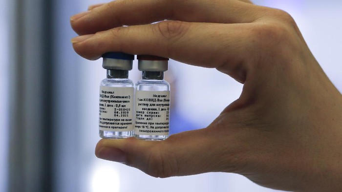 Virus Outbreak Russia Vaccine In this handout photo taken on Thursday, Aug. 6, 2020, and provided by Russian Direct Investment Fund, an employee shows a new vaccine at the Nikolai Gamaleya National Center of Epidemiology and Microbiology in Moscow, Russia. Russia on Tuesday, Aug. 11 became the first country to approve a coronavirus vaccine for use in tens of thousands of its citizens despite international skepticism about injections that have not completed clinical trials and were studied in only dozens of people for less than two months. (Alexander Zemlianichenko Jr/ Russian Direct Investment Fund via AP)