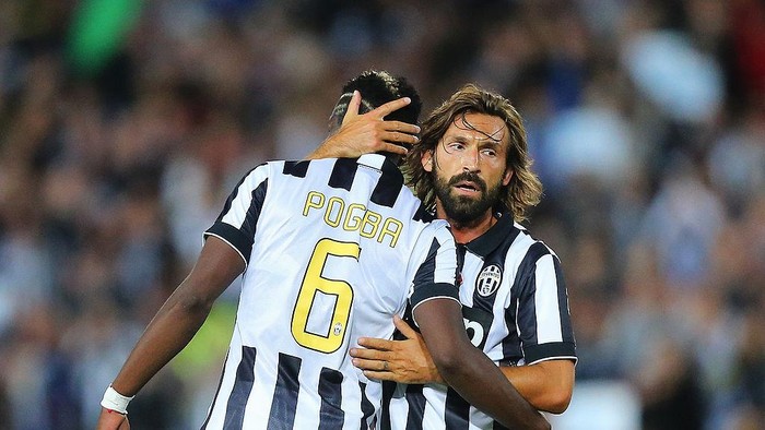 SYDNEY, AUSTRALIA - AUGUST 10: Paul Pogba (L) of Juventus celebrates his goal with Andrea Pirlo of Juventus during the match between the A-League All Stars and Juventus at ANZ Stadium on August 10, 2014 in Sydney, Australia.  (Photo by Joosep Martinson/Getty Images)