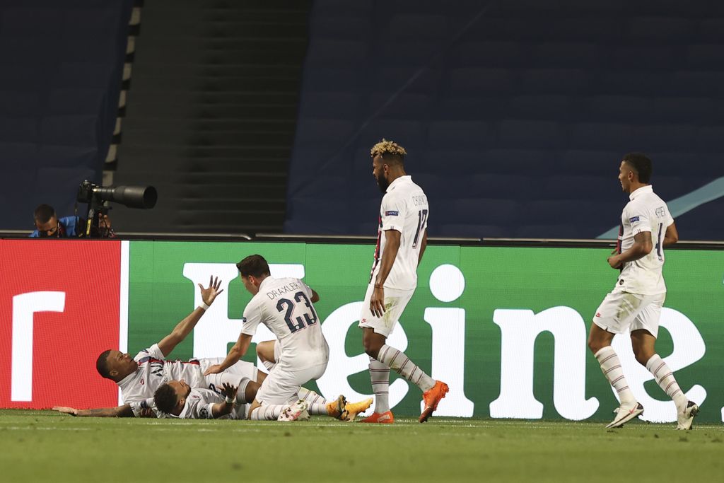 PSG's players celebrate the second goal of their team during the Champions League quarter-final soccer match between Atalanta and Paris Saint-Germain, at the Luz stadium in Lisbon, Portugal, Wednesday, Aug. 12, 2020. PSG won 2-1. (Rafael Marchante/Pool via AP)