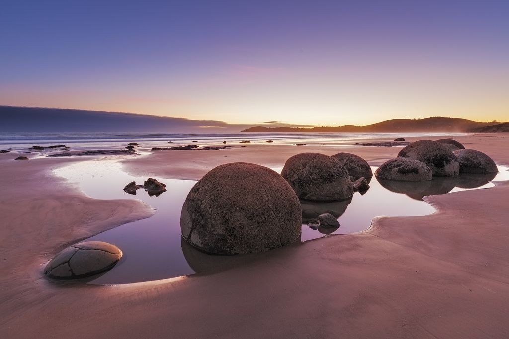 Round Moeraki Boulders at sunset, Koekohe beach, Otago, South Island, New Zealand.