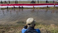 Kegiatan membentangkan kain Merah Putih di Sungai Cikijing diketahui dilakukan oleh Pasukan Susur Sungai dan Ekosistem Rancaekek (Passer). 