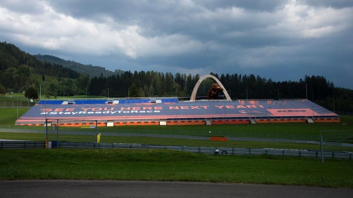 SPIELBERG, AUSTRIA - AUGUST 13: The empty grandstand in circuit with a greets for fans during the MotoGP Of Austria - Previews at Red Bull Ring on August 13, 2020 in Spielberg, Austria. (Photo by Mirco Lazzari gp/Getty Images)