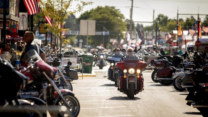 Bikers walk down Main Street during the 80th annual Sturgis Motorcycle Rally on Saturday, Aug. 15, 2020, in Sturgis, S.D. (Amy Harris/Invision/AP)
