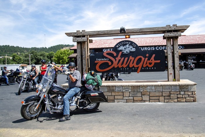 Bikers walk down Main Street during the 80th annual Sturgis Motorcycle Rally on Saturday, Aug. 15, 2020, in Sturgis, S.D. (Amy Harris/Invision/AP)