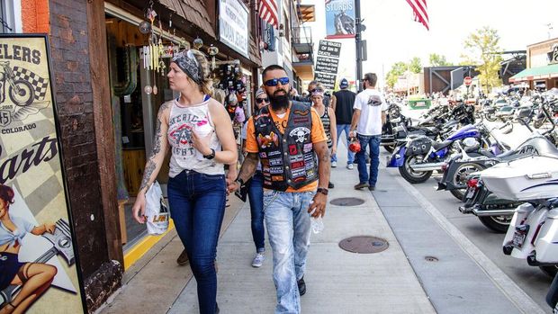 Bikers walk down Main Street during the 80th annual Sturgis Motorcycle Rally on Saturday, Aug. 15, 2020, in Sturgis, S.D. (Amy Harris/Invision/AP)