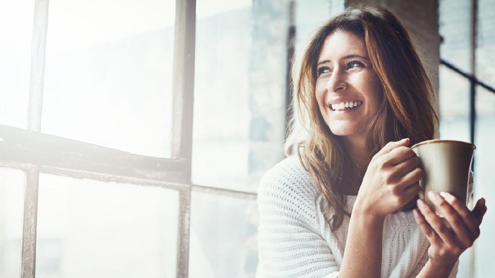 Shot of an attractive young woman relaxing at home