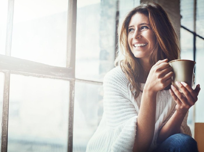 Shot of an attractive young woman relaxing at home