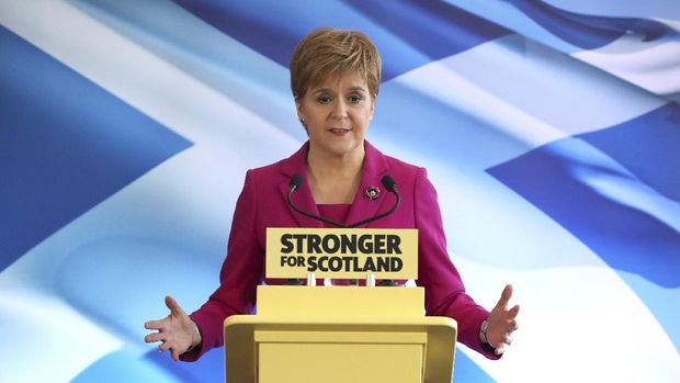 Scottish National Party (SNP) leader Nicola Sturgeon speaks at the launch of the party's General Election campaign backdropped by the Scottish saltire flag, in Edinburgh, Scotland, Friday Nov. 8, 2019.  The Scottish National Party is officially launching its campaign for Britain’s upcoming Dec. 12 election, with the SNP hoping to put Scotland a step closer to independence. (Andrew Milligan/PA via AP)