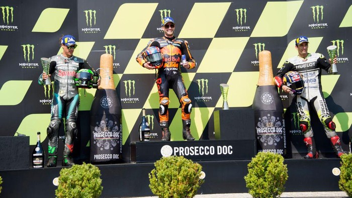 BRNO, CZECH REPUBLIC - AUGUST 09: (L-R) Franco Morbidelli of Italy and Petronas Yamaha SRT, Brad Binder of South Africa and Red Bull KTM Factory Racing  and Johann Zarco of France and Reale Avintia Racing celebrate on the podium  at the end of the MotoGP race during the MotoGP Of Czech Republic at Brno Circuit on August 09, 2020 in Brno, Czech Republic. (Photo by Mirco Lazzari gp/Getty Images)