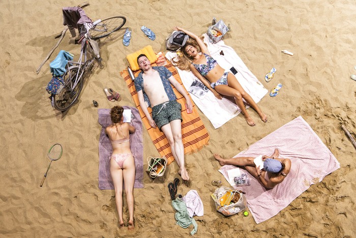 Switzerland Beach Opera Beach guests with microphones, sing a never-ending opera entitled