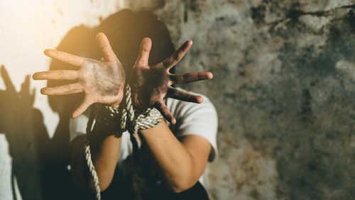 Helpless young woman hands tied with rope, Missing kidnapped, Hostage, human trafficking and violence concept