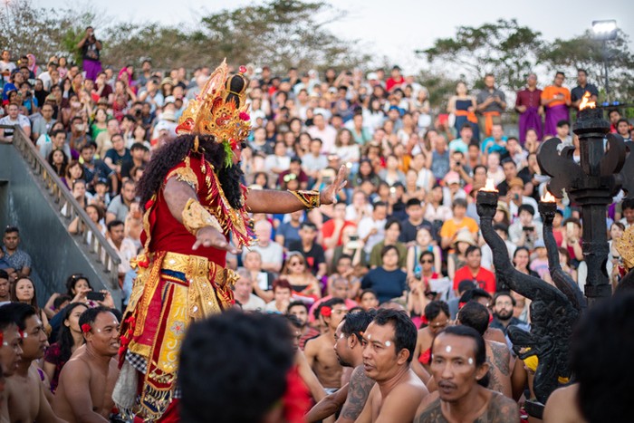 Bali, Indonesia - June 5, 2013: Traditional Ritual Balinese Kecak dance with elements of trance performed by men artists in traditional costumes  at Uluwatu Temple in the evening.