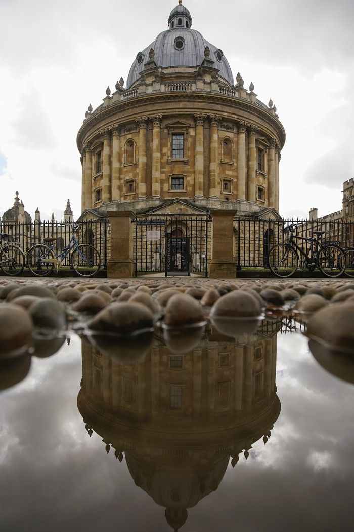 OXFORD, ENGLAND - AUGUST 25: Books requested by readers are placed in hygienic bags in the Radcliffe Camera at the Bodleian Libraries on August 25, 2020 in Oxford, England. The world famous libraries closed in mid-March due to the coronavirus pandemic. After putting in strict social distancing measures the Oxford University Libraries have partially opened for students and academics. A gradual reopening to the public, via online booking, begins on September 1.  (Photo by Christopher Furlong/Getty Images)