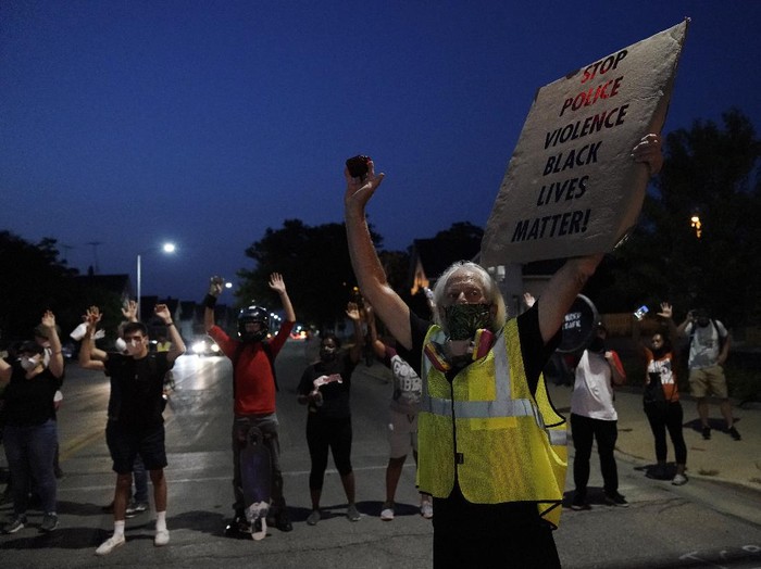 People gather to protestWednesday, Aug. 256 2020 in Kenosha, Wis. Anger over the Sunday shooting of Jacob Blake, a Black man, by police spilled into the streets for a fourth night. (AP Photo/Morry Gash)
