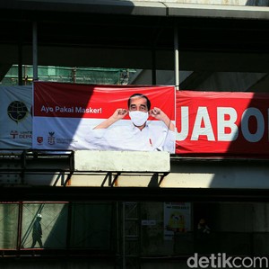 Lewat Spanduk, Jokowi Ajak Warga Gunakan Masker