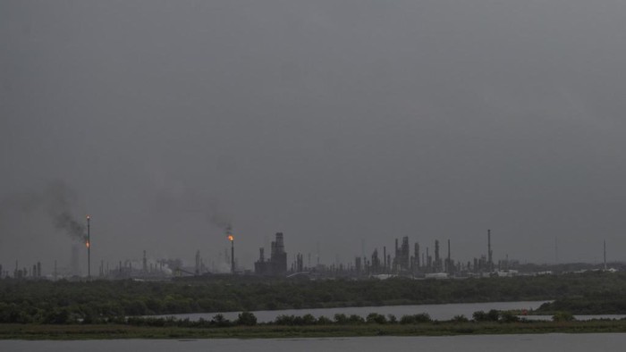 A gas terminal is seen as the first band of rain from Hurricane Laura passes in Lake Charles, Louisiana on August 26, 2020. - Hurricane Laura is due to strengthen to Category 4 before slamming into the US south coast later Wednesday, forecasters said, as residents of coastal Texas and Louisiana were told to evacuate or shelter. With maximum sustained winds currently of 115 miles (185 kilometers) per hour, the hurricane could trigger a storm surge raising water levels by several feet and affecting areas as much as 30 miles inland. (Photo by ANDREW CABALLERO-REYNOLDS / AFP)