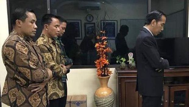 Brigadier General Moh Hasan (far right) while on duty escorting President Jokowi