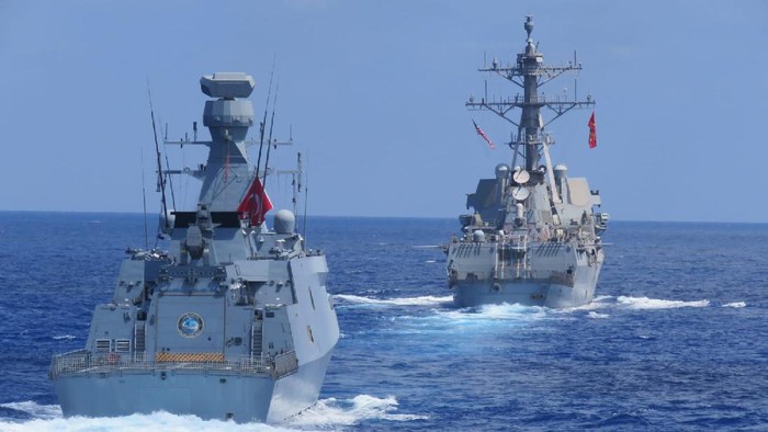 US destroyer USS Winston S. Churchill, rear, along with Turkish frigate TCG Barbaros conduct maritime trainings in the Eastern Mediterranean, Wednesday, Aug. 26, 2020, to improve coordination and interoperability.(Turkish Defense Ministry via AP, Pool)