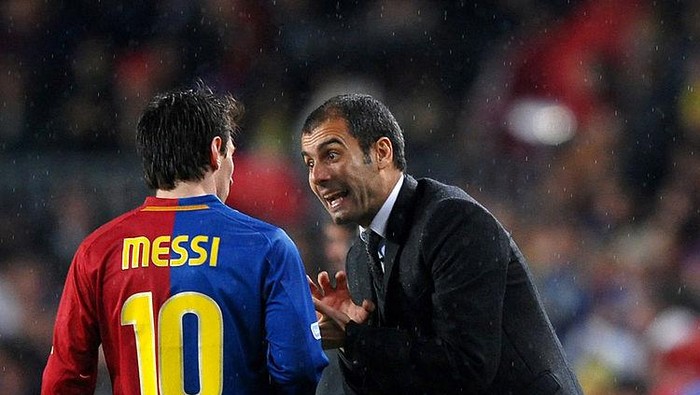 BARCELONA, SPAIN - DECEMBER 13:  Coach Pep Guardiola (R) of Barcelona instructs Lionel Messi during the La Liga match between Barcelona and Real Madrid at the Camp Nou Stadium on December 13, 2008 in Barcelona, Spain. Barcelona won the match 2-0.  (Photo by Jasper Juinen/Getty Images)