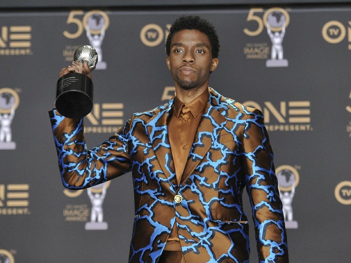 FILE - In this Saturday, March 30, 2019 file photo, Chadwick Boseman poses in the press room with the award for outstanding actor in a motion picture for Black Panther at the 50th annual NAACP Image Awards at the Dolby Theatre in Los Angeles. Actor Chadwick Boseman, who played Black icons Jackie Robinson and James Brown before finding fame as the regal Black Panther in the Marvel cinematic universe, has died of cancer. His representative says Boseman died Friday, Aug. 28, 2020 in Los Angeles after a four-year battle with colon cancer. He was 43. (Photo by Richard Shotwell/Invision/AP, File)