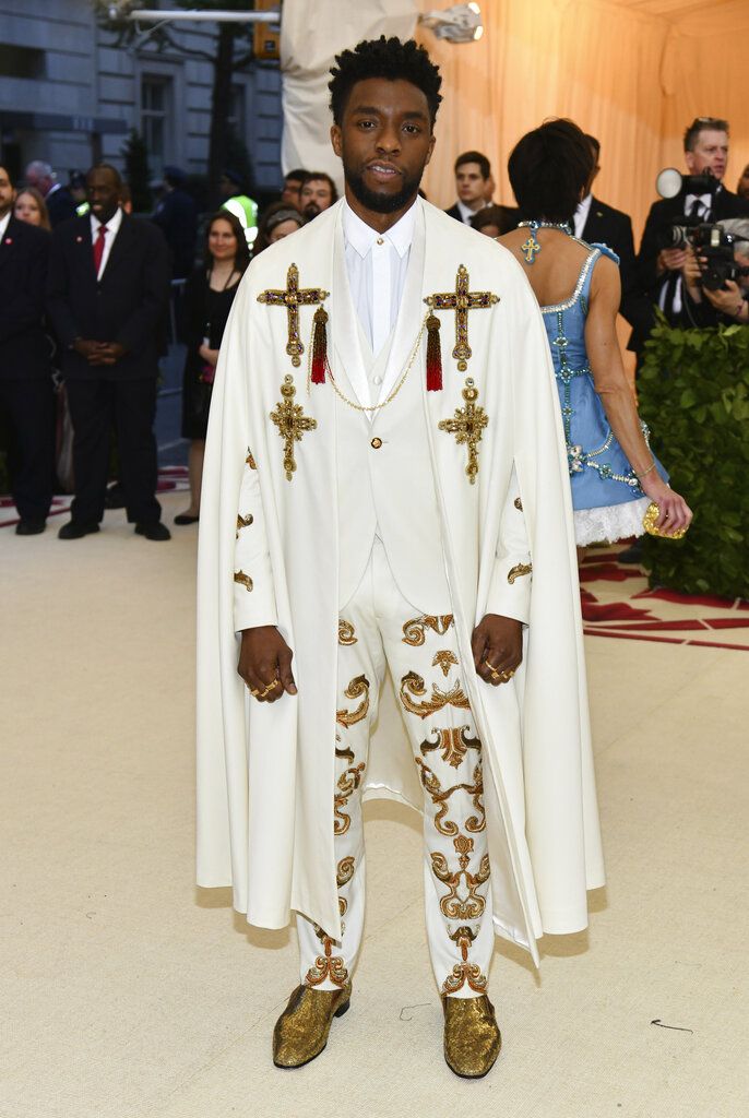 FILE - In this May 7, 2018 file photo, Chadwick Boseman attends The Metropolitan Museum of Art's Costume Institute benefit gala celebrating the opening of the Heavenly Bodies: Fashion and the Catholic Imagination exhibition in New York.  Boseman, who played Black icons Jackie Robinson and James Brown before finding fame as the regal Black Panther in the Marvel cinematic universe, has died of cancer. His representative says Boseman died Friday, Aug. 28, 2020 in Los Angeles after a four-year battle with colon cancer. He was 43. (Photo by Charles Sykes/Invision/AP, File)