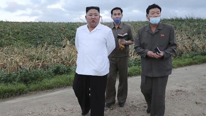 In this undated photo provided on Friday, Aug. 28, 2020, by the North Korean government, North Korean leader Kim Jong Un, left, visits a western coastal area in South Hwanghae province, North Korea, where Typhoon Bavi made landfall early Thursday, Aug. 27. Independent journalists were not given access to cover the event depicted in this image distributed by the North Korean government. The content of this image is as provided and cannot be independently verified. Korean language watermark on image as provided by source reads: 