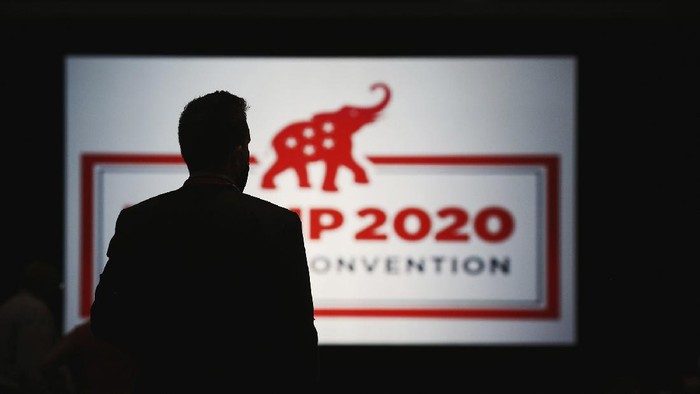 FILE - In this Aug. 24, 2020 file photo, the room is set and delegates begin to arrive for the first day of the Republican National Convention in Charlotte, N.C.  Four people who were at the Republican National Convention in Charlotte have tested positive for the coronavirus, health officials in North Carolina’s Mecklenburg County said. WBTV reported Friday, Aug. 28  that those who tested positive at the event were immediately isolated. (Travis Dove/The New York Times via AP, Pool, File)